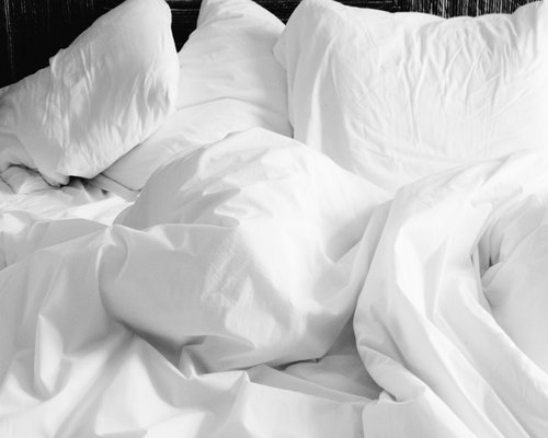 Cozy minimal bedroom interior representing standard restful environment and healthy sleep habits